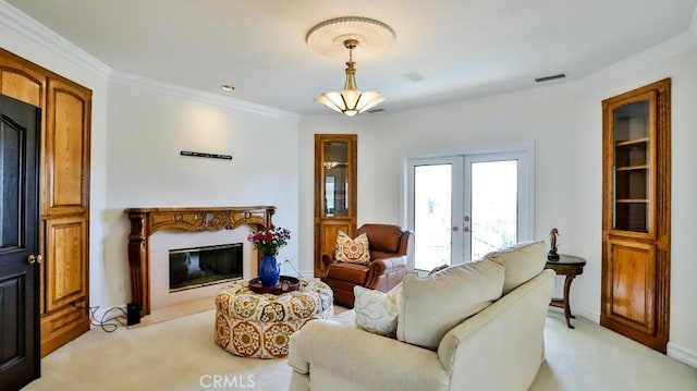 25782 Highplains Ter, Laguna Hills, CA 92653 - living area featuring french doors, light colored carpet, a premium fireplace, and ornamental molding