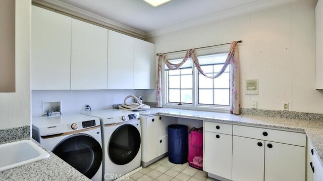 25782 Highplains Ter, Laguna Hills, CA 92653 - washroom with cabinet space, washing machine and dryer, and ornamental molding