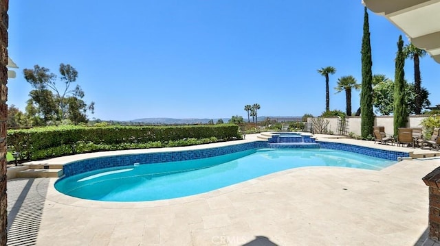 25782 Highplains Ter, Laguna Hills, CA 92653 - view of pool with a patio, a mountain view, and a pool with connected hot tub