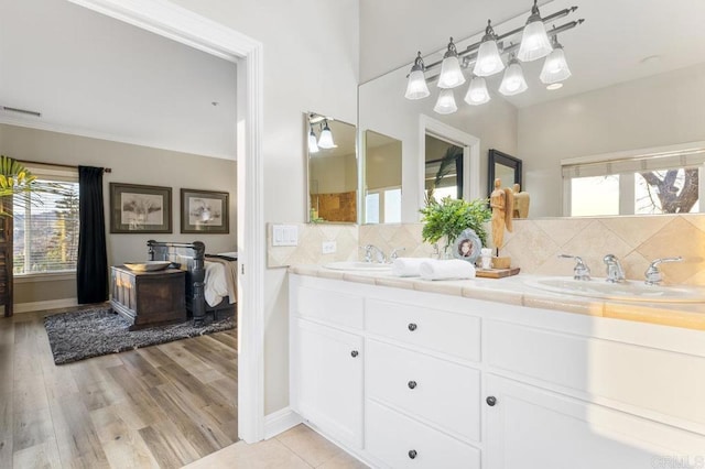 1078 Rainbow Crest Rd, Fallbrook, CA 92028 - full bathroom featuring backsplash, double vanity, and wood finished floors