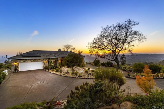 1078 Rainbow Crest Rd, Fallbrook, CA 92028 - view of front of property featuring concrete driveway, solar panels, stone siding, and a garage