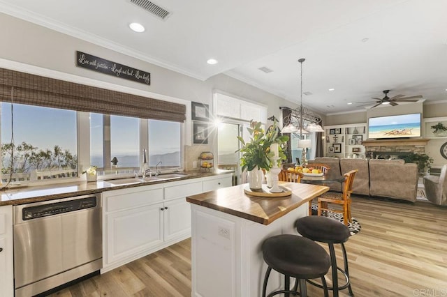1078 Rainbow Crest Rd, Fallbrook, CA 92028 - kitchen with stainless steel dishwasher, a sink, a ceiling fan, white cabinetry, and light wood-style flooring