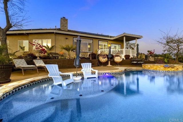 1078 Rainbow Crest Rd, Fallbrook, CA 92028 - back of property with solar panels, a chimney, an outdoor pool, and a patio area