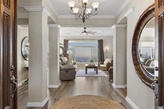 1078 Rainbow Crest Rd, Fallbrook, CA 92028 - entryway with decorative columns, wood finished floors, baseboards, a chandelier, and ornamental molding