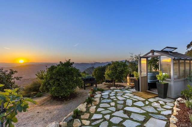1078 Rainbow Crest Rd, Fallbrook, CA 92028 - patio terrace at dusk with a greenhouse and an outbuilding