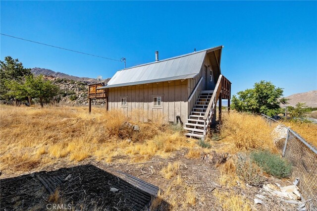 17021 Linda Ln, Onyx, CA 93255 - view of side of home with stairs, metal roof, and a mountain view