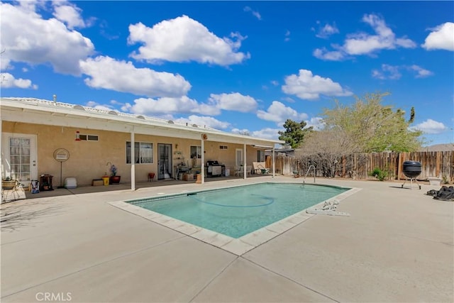 view of pool with a patio, a fenced in pool, and fence