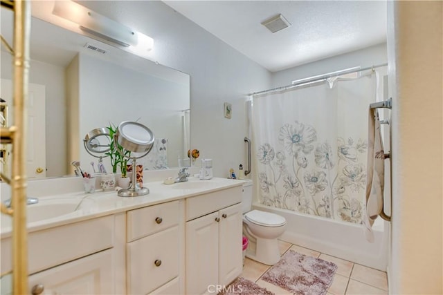 full bath with tile patterned flooring, shower / tub combo with curtain, toilet, visible vents, and a sink