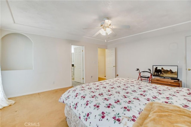 bedroom with baseboards, a ceiling fan, and light colored carpet
