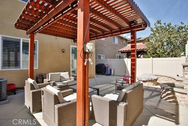 view of patio with fence, a pergola, and an outdoor hangout area