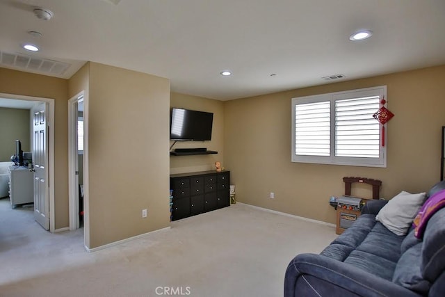 carpeted living room with recessed lighting, baseboards, and visible vents