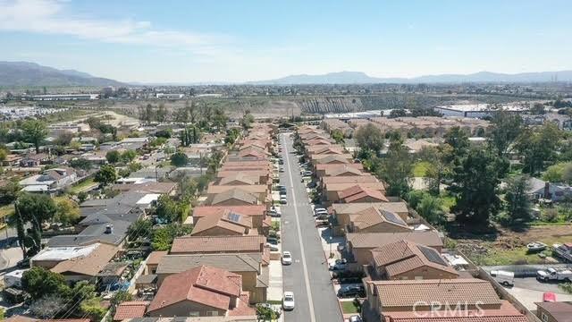drone / aerial view featuring a residential view and a mountain view