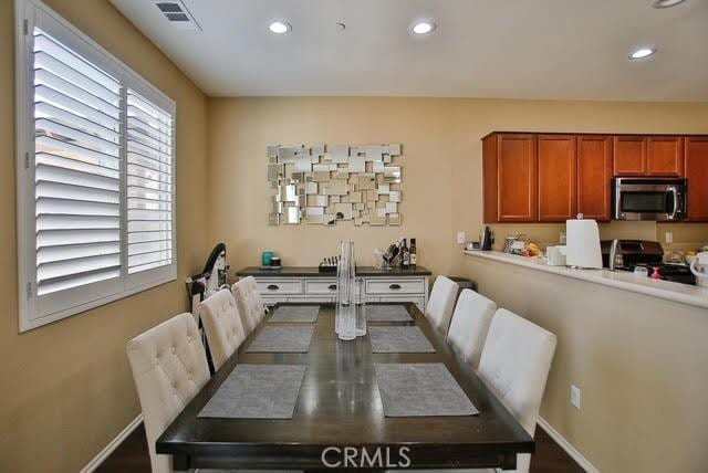 dining area featuring recessed lighting, baseboards, and visible vents