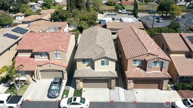 birds eye view of property with a residential view