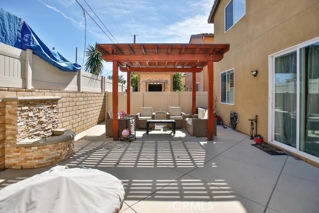 view of patio / terrace featuring an outdoor hangout area, a pergola, and a fenced backyard