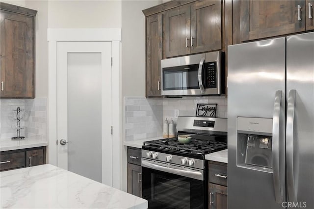 1924 Crandall Way, Paradise, CA 95969 - kitchen with appliances with stainless steel finishes, dark brown cabinets, and decorative backsplash