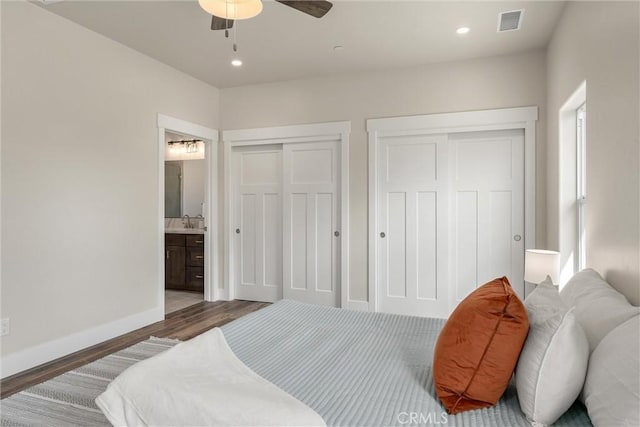 1924 Crandall Way, Paradise, CA 95969 - bedroom featuring multiple closets, wood finished floors, connected bathroom, baseboards, and recessed lighting