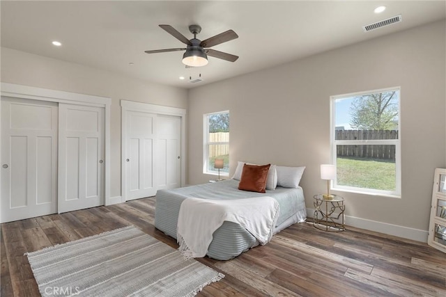1924 Crandall Way, Paradise, CA 95969 - bedroom with two closets, wood finished floors, baseboards, recessed lighting, and a ceiling fan