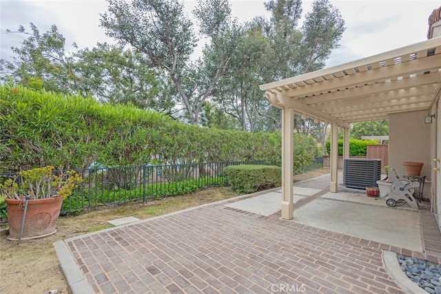 view of patio featuring central AC, a pergola, and fence private yard