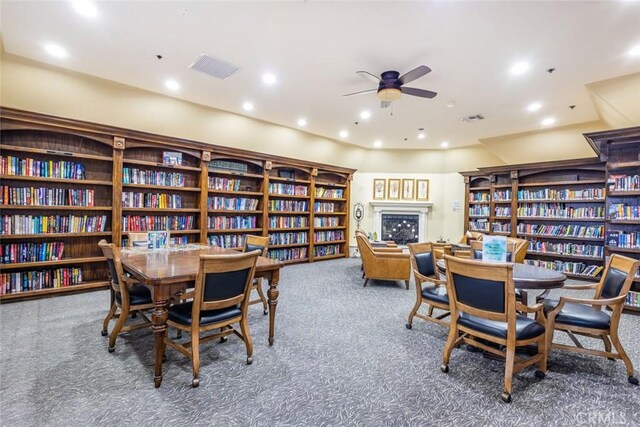 carpeted dining room with ceiling fan, recessed lighting, and visible vents