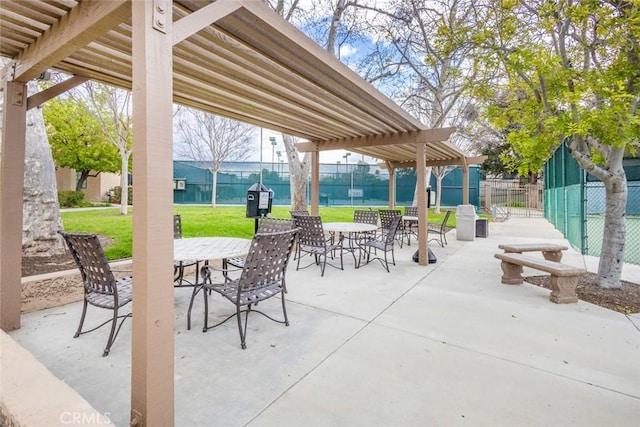 view of patio / terrace with fence, outdoor dining space, and a pergola