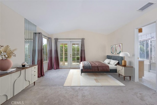 bedroom featuring access to outside, visible vents, vaulted ceiling, french doors, and light colored carpet