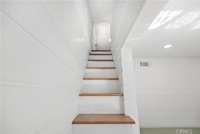 stairs featuring recessed lighting and visible vents