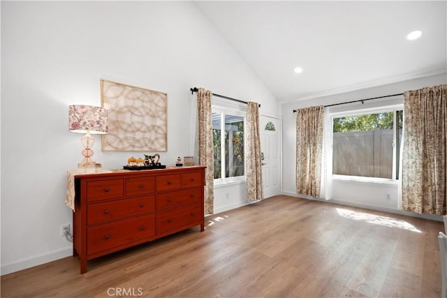 bedroom with high vaulted ceiling, recessed lighting, light wood-type flooring, and baseboards