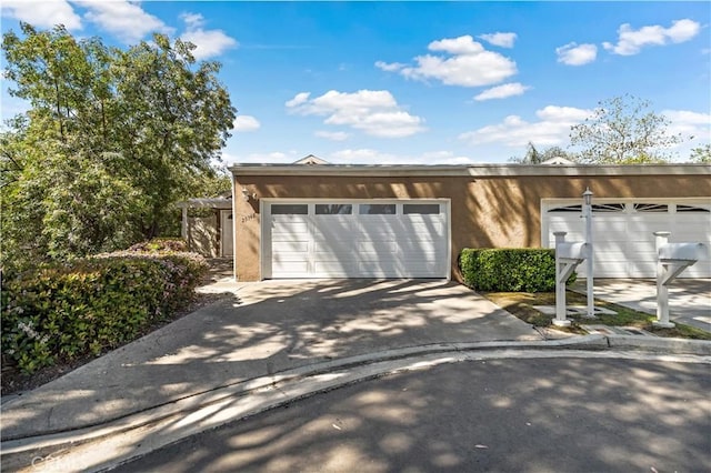 exterior space featuring concrete driveway