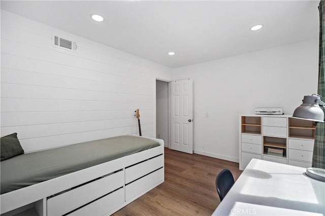bedroom with wood finished floors, visible vents, and recessed lighting