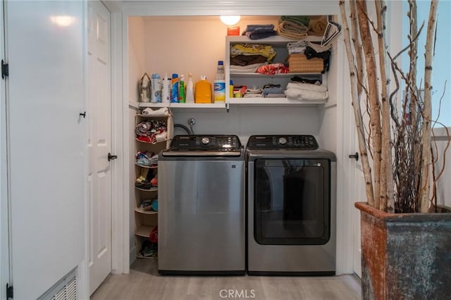 207 Knox St, Costa Mesa, CA 92627 - laundry room featuring washing machine and clothes dryer and wood finished floors