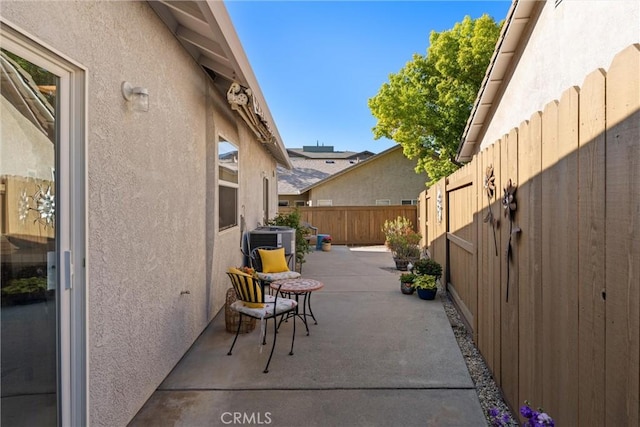 view of patio / terrace with a fenced backyard and cooling unit