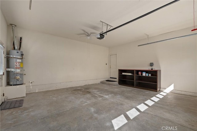 garage with a garage door opener and secured water heater