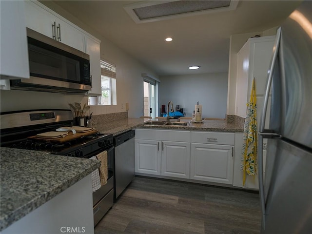 1094 Award Dr, Colton, CA 92324 - kitchen featuring appliances with stainless steel finishes, a sink, dark wood finished floors, white cabinets, and recessed lighting