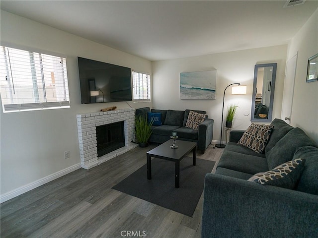 1094 Award Dr, Colton, CA 92324 - living area featuring wood finished floors, baseboards, and a fireplace
