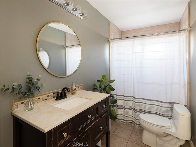 full bathroom featuring tile patterned floors, toilet, curtained shower, and vanity