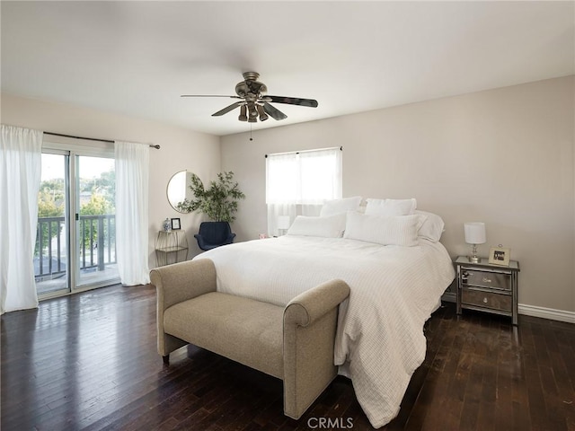 bedroom with access to outside, dark wood finished floors, ceiling fan, and multiple windows