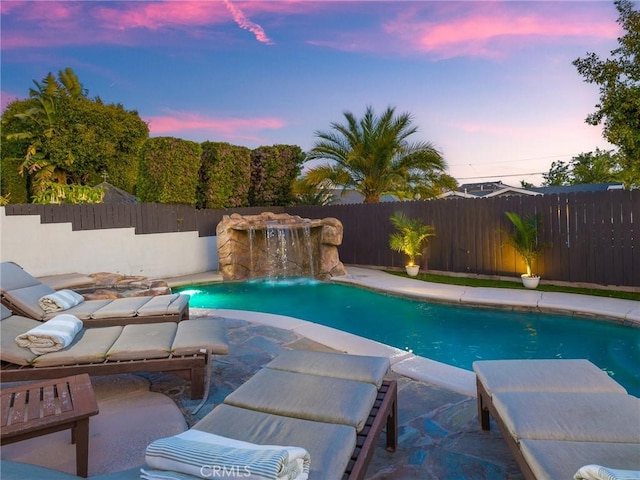 view of swimming pool featuring a fenced in pool, a patio, and a fenced backyard