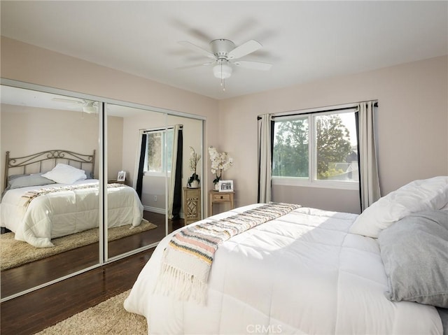bedroom with a closet, a ceiling fan, and wood finished floors