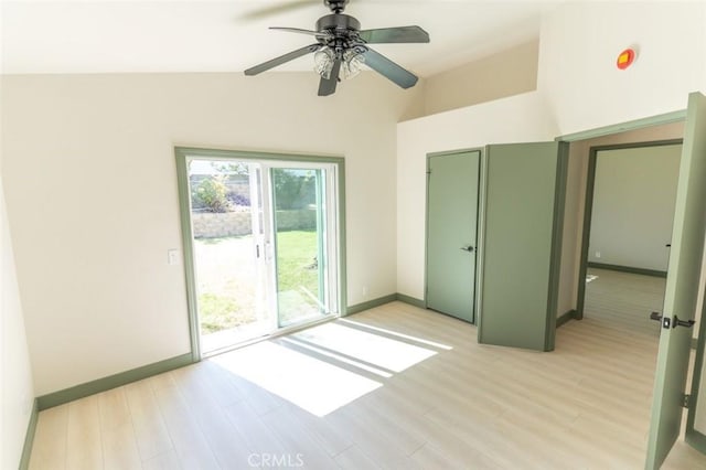 interior space with light wood-style floors, baseboards, and ceiling fan
