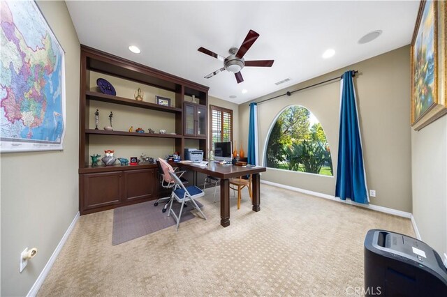 office featuring visible vents, baseboards, a ceiling fan, recessed lighting, and light colored carpet