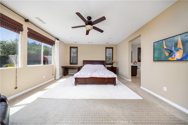 bedroom featuring visible vents, baseboards, a ceiling fan, and light colored carpet