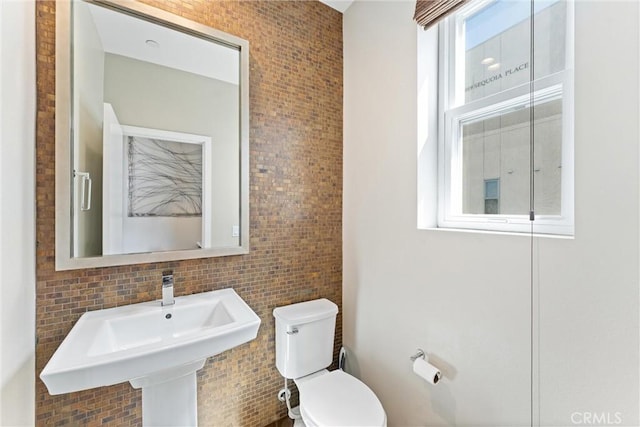315 Mission Rd, Montebello, CA 90640 - bathroom with a sink, tile walls, and toilet