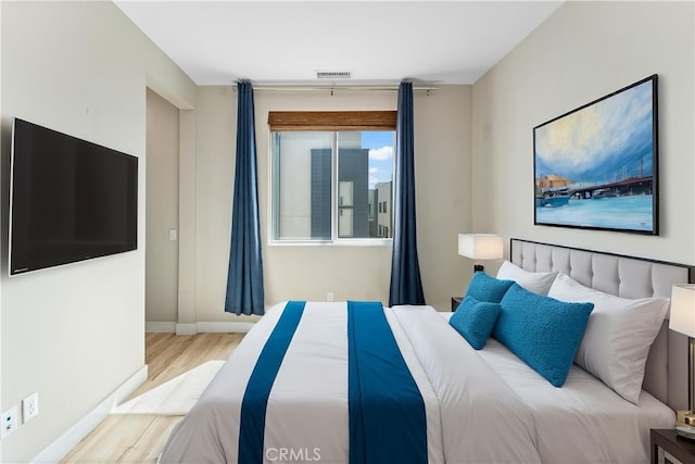 315 Mission Rd, Montebello, CA 90640 - bedroom with visible vents, baseboards, and wood finished floors