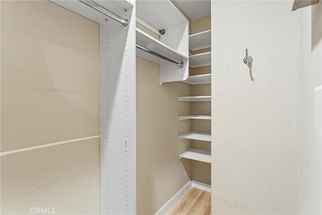 315 Mission Rd, Montebello, CA 90640 - walk in closet featuring wood finished floors