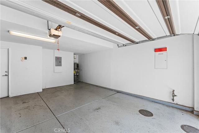 315 Mission Rd, Montebello, CA 90640 - garage featuring a garage door opener and electric panel