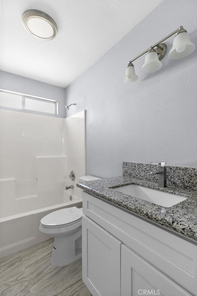 12433 Senecio Ave, Victorville, CA 92395 - bathroom with toilet, vanity, and shower / washtub combination