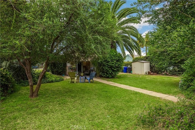 755 E 11th St, Pomona, CA 91766 - view of grassy yard with a storage unit