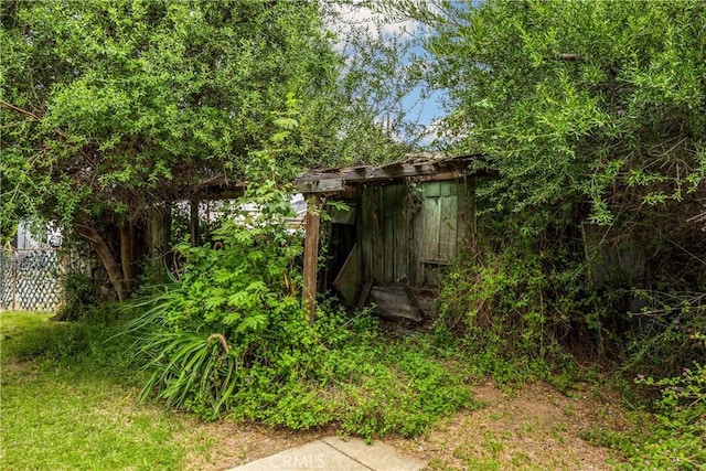 755 E 11th St, Pomona, CA 91766 - view of yard featuring an outbuilding