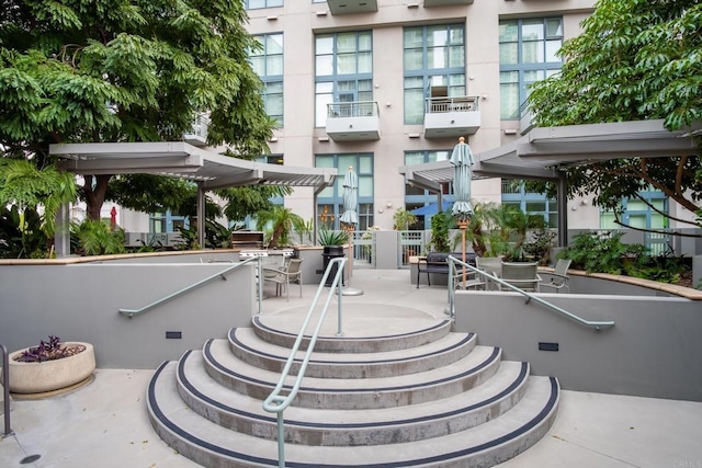 surrounding community with a pergola